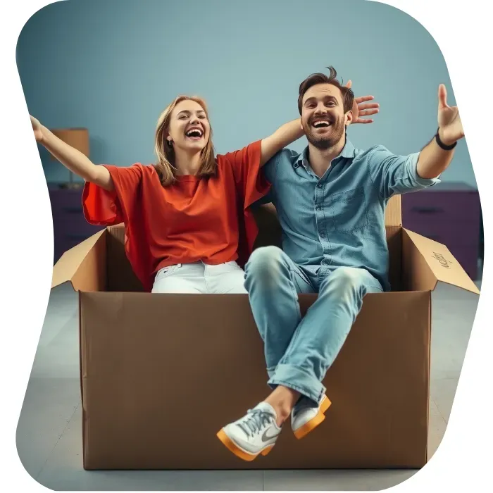 Two guys sitting on the floor of their apartment with Muval moving boxes